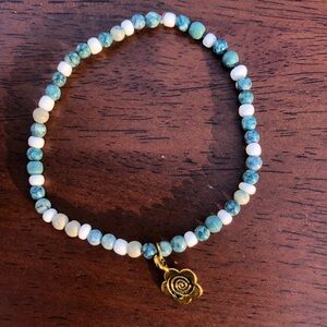 Handmade bracelet with a flower charm 🌸